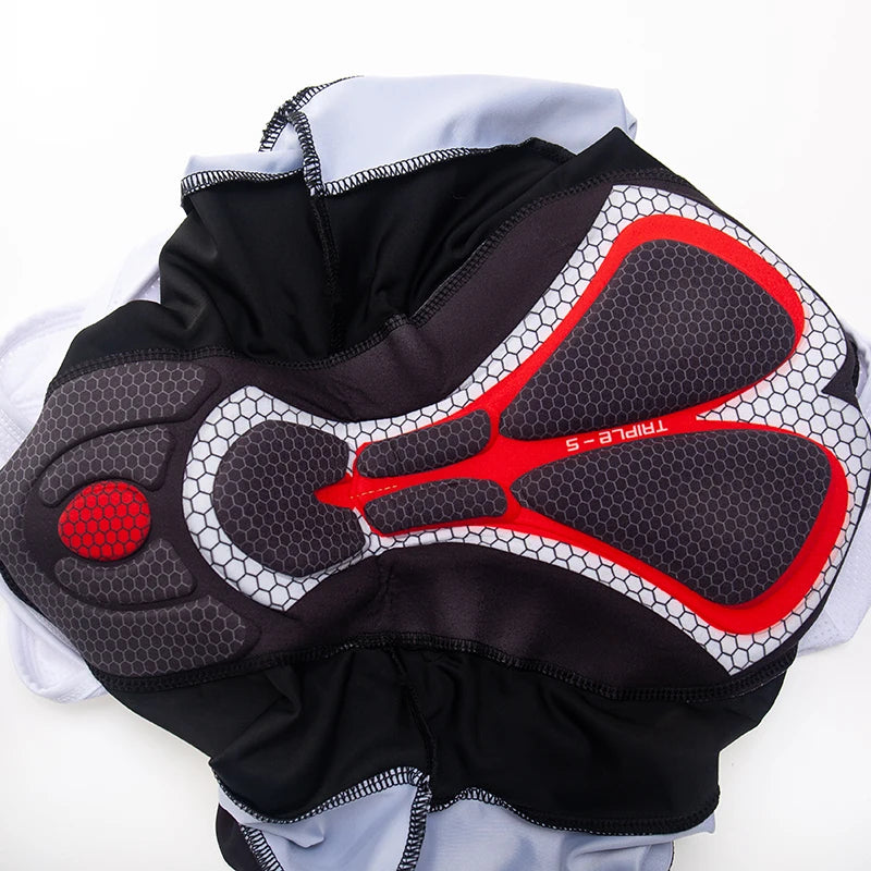 Black and red protective gear with honeycomb pattern on a white background