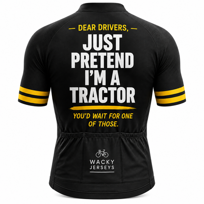 Black short-sleeve cycling jersey shown from the back with bold white and yellow text reading 'DEAR DRIVERS, JUST PRETEND I'M A TRACTOR YOU'D WAIT FOR ONE OF THOSE.' and 'WACKY JERSEYS' branding near the lower back, plus yellow stripe accents on the sleeves.