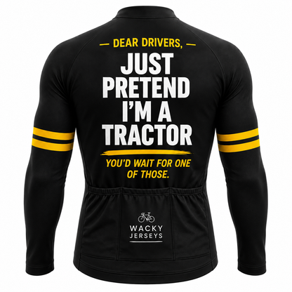 Black long-sleeve cycling jersey shown from the back with bold white and yellow text reading 'DEAR DRIVERS, JUST PRETEND I'M A TRACTOR YOU'D WAIT FOR ONE OF THOSE.' and 'WACKY JERSEYS' branding near the lower back pocket.