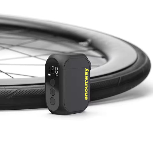 Digital tire pressure monitor with bicycle wheel in the background